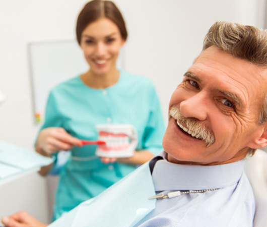 Dentures patient in Derry smiling at dentist