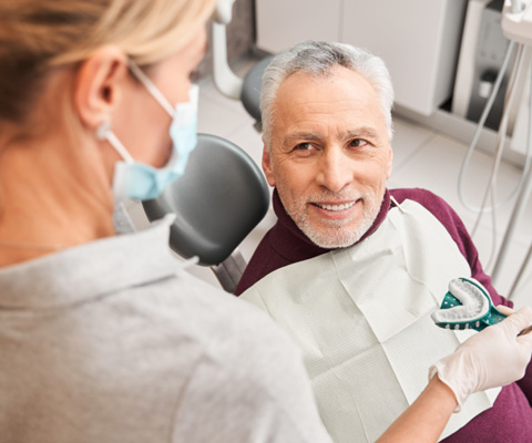 Dentures patient in Derry smiling at the dentist
