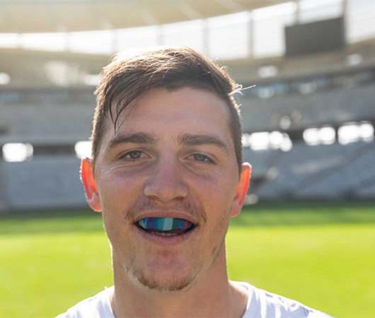 Young man wearing athletic mouthguard