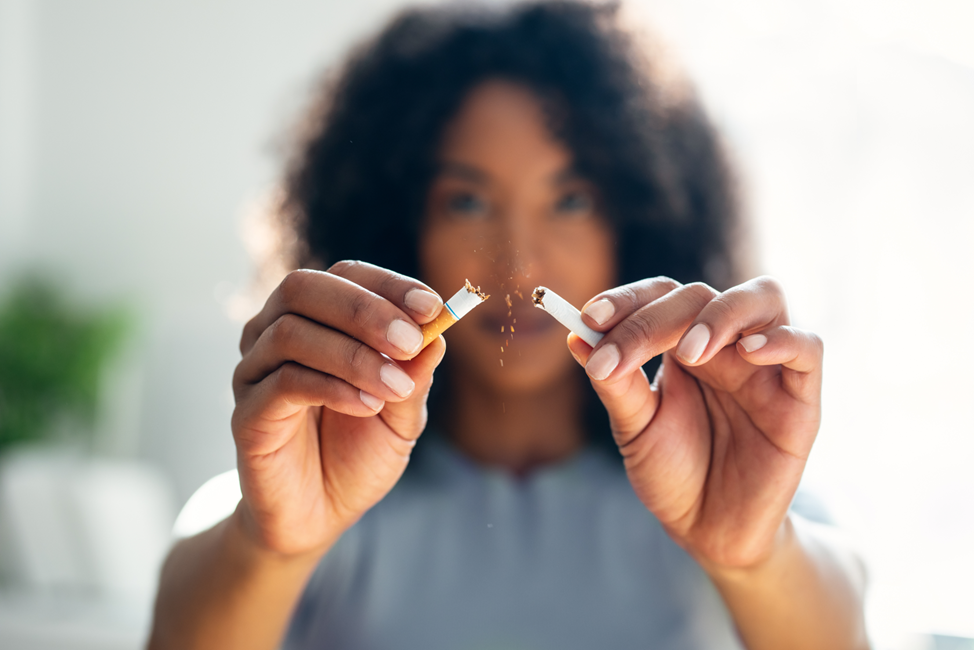 woman breaking cigarette